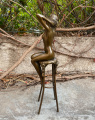 Статуэтка из бронзы Обнаженная женщина на стуле